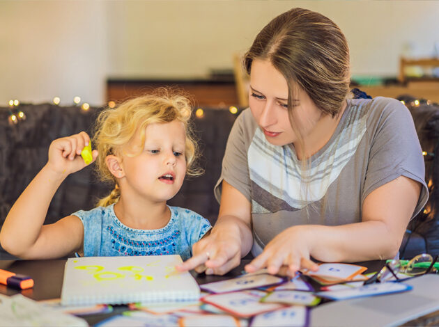 Photo of a parent and child learning